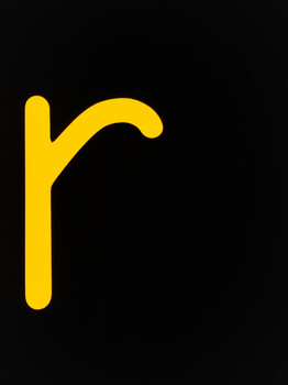 Yellow curved line graphic resembling a stylized hook or bracket shape.