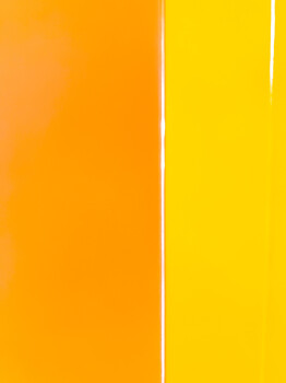 Graphic illustration of a vertical color gradient transitioning from warm orange on the left to bright yellow on the right.