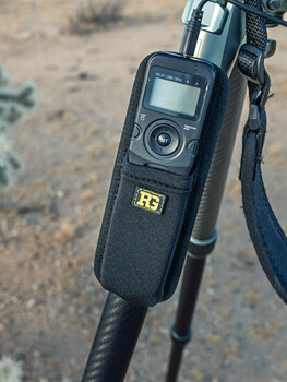 Remote trigger device with LCD screen mounted on camera hot shoe with shoulder strap
