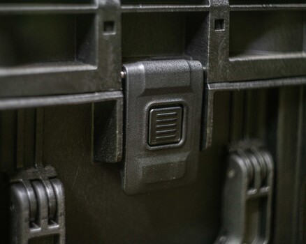 Close-up of a rugged case latch mechanism with textured metal hardware