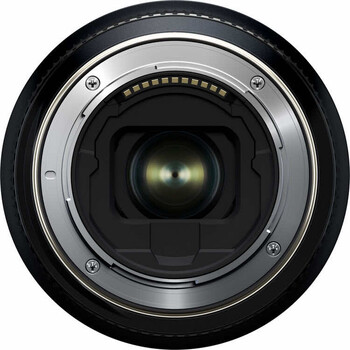 Rear view of camera lens showing metal mount ring and electronic contacts