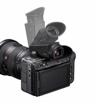 Professional cinema camera with attached wide-angle lens and articulating monitor displayed against neutral background