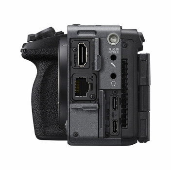 Side view of a professional cinema camera body showing ports, connectors, and grip