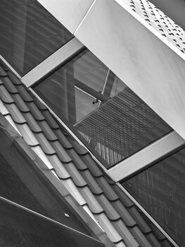 Abstract black and white architectural composition of overlapping geometric planes and roof tiles