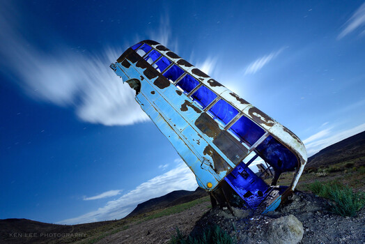 Dutch angle of a rather strangely-parked bus.