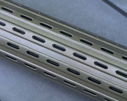 Close-up of perforated metal slotted angle or strut channel with elongated holes