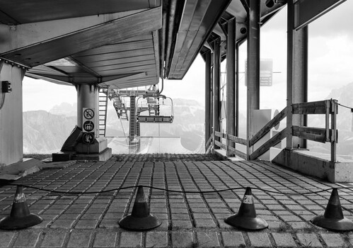 Interior of industrial building with geometric grid floor and structural beams