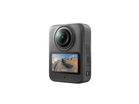 Compact action camera with flip-out touchscreen displaying desert landscape footage