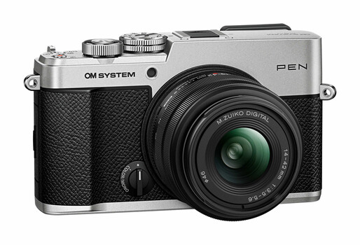 Olympus OM System PEN camera with silver top plate and black textured grip, featuring an attached Olympus Digital lens