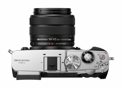 OM System OM-1 Mark II mirrorless camera with 14-42mm f/3.5-5.6 lens, top-down view
