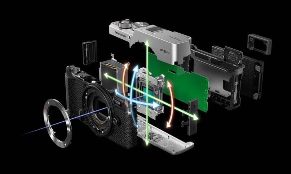 Exploded diagram illustration of a compact camera's internal components and construction