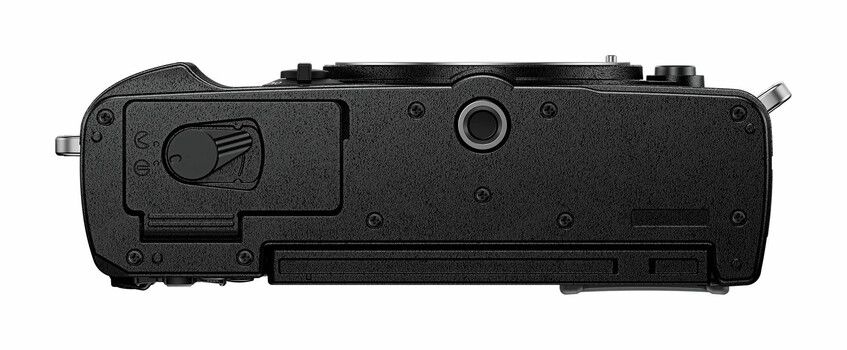 Top view of a black mirrorless camera body showing the baseplate and battery compartment