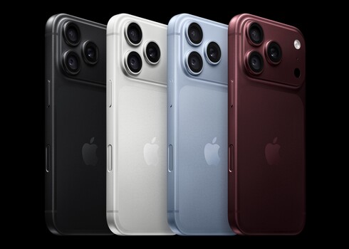 Four smartphones arranged in a row displaying different color finishes against a black background