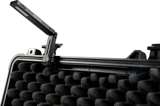 Black equipment case with foam insert and articulating arm attachment mounted on top