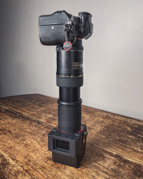 Gimbal stabilizer with mounted camera mounted on pole with battery base
