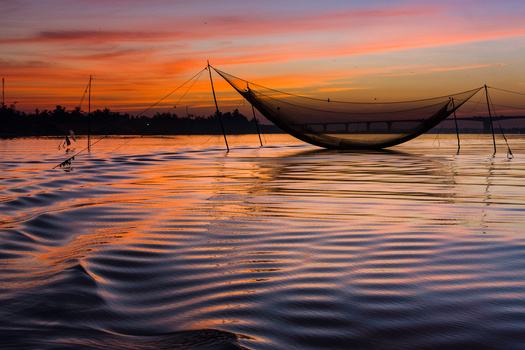 Image "Sunrise over the fishing nets." by Michael Tzur