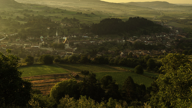 Image "Sunrise over Sashiz village, Romania" by George Dumbrava