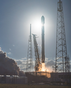 Image "Flame detail on a Silhouetted Falcon 9" by Ryan Chylinski