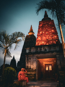 Image "Mahabodhi Temple and Monk" by Javier Aleuanlli
