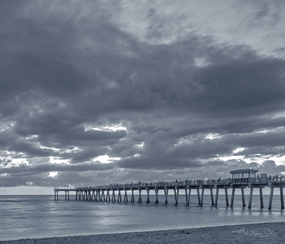 Clouds over the pier by Christopher Suckow