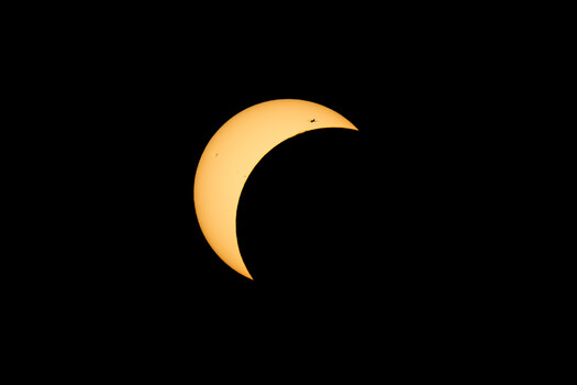 Image "Plane Crossing the Partial Eclipse" by Siarhei Alkhovik