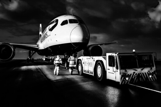 Image "Dreamliner on the apron with tug and ground crew" by Pete Thomas