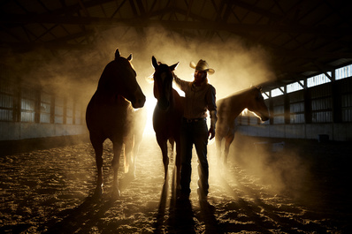 Barrel Racer with her horse by John Rowland