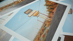 Architectural or landscape design mockup displayed on blue presentation boards with printed photographs and diagrams.
