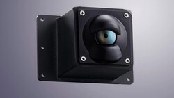 Black modular camera with spherical lens housing and adjustable mounting bracket against gray background.