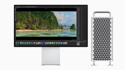 Mac Pro tower next to studio display showing tropical landscape in editing software.