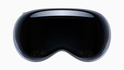 Front view of a spatial computing headset with a curved display and dark lens area.