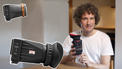 Man holding a thermal imaging camera while demonstrating handheld thermal devices.
