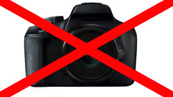 Black DSLR camera with red X overlay symbol indicating prohibition or rejection.