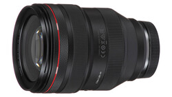 Black telephoto lens with red accent ring and textured grip sections.