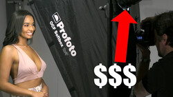 Professional studio portrait setup with model, lighting equipment, and photographer during a commercial shoot.