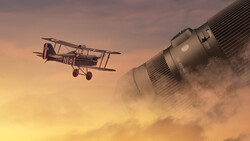 Vintage biplane in flight against a golden sunset sky with an airship partially visible on the right.