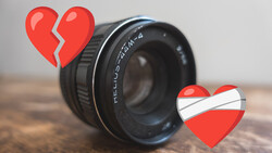 A vintage Helios camera lens with broken heart illustrations positioned above and beside it.