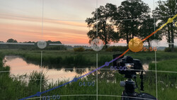 Camera on tripod with sunset landscape and time-lapse data visualization overlay.