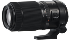 Black telephoto zoom lens with focus ring and stabilization controls visible on barrel.