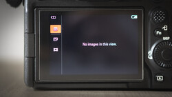 Screenshot of a digital camera's LCD screen displaying an empty gallery view with "No images in this view" message.