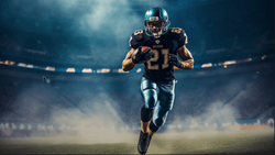 Football player wearing number 21 running with the ball across a stadium field.