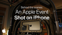 Screenshot of Apple's "Behind the scenes: An Apple Event Shot on iPhone" title card displayed on a professional film production monitor mounted inside a camera rig.