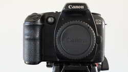 Canon EOS R30 mirrorless camera body front view showing grip and lens mount.