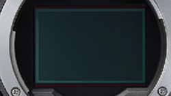 Screenshot of a camera's LCD screen displaying a blank teal-colored viewfinder display.