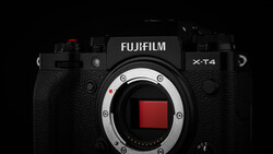 Fujifilm X-T4 mirrorless camera body with open sensor mount against black background.