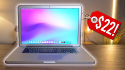 MacBook Pro laptop displaying colorful gradient wallpaper with red price tag showing $221.