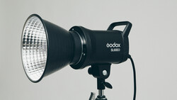 Godox SL60D LED light head mounted on a stand against a neutral gray background.