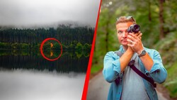 Man in blue shirt holding binoculars with forest lake landscape circled in red on left side.