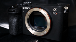 Sony α7CR mirrorless camera body with lens mount visible against dark background.