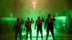 Four silhouetted figures stand in formation facing forward against vibrant green and red neon lighting.